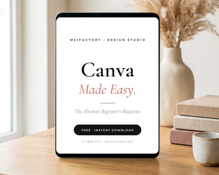 Canva Made Easy — the free guide on a tablet, in a warm styled studio scene